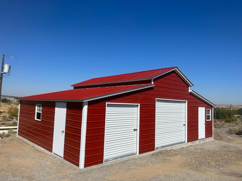 A steel ag building sitting on a cut-and-filled hillside pad