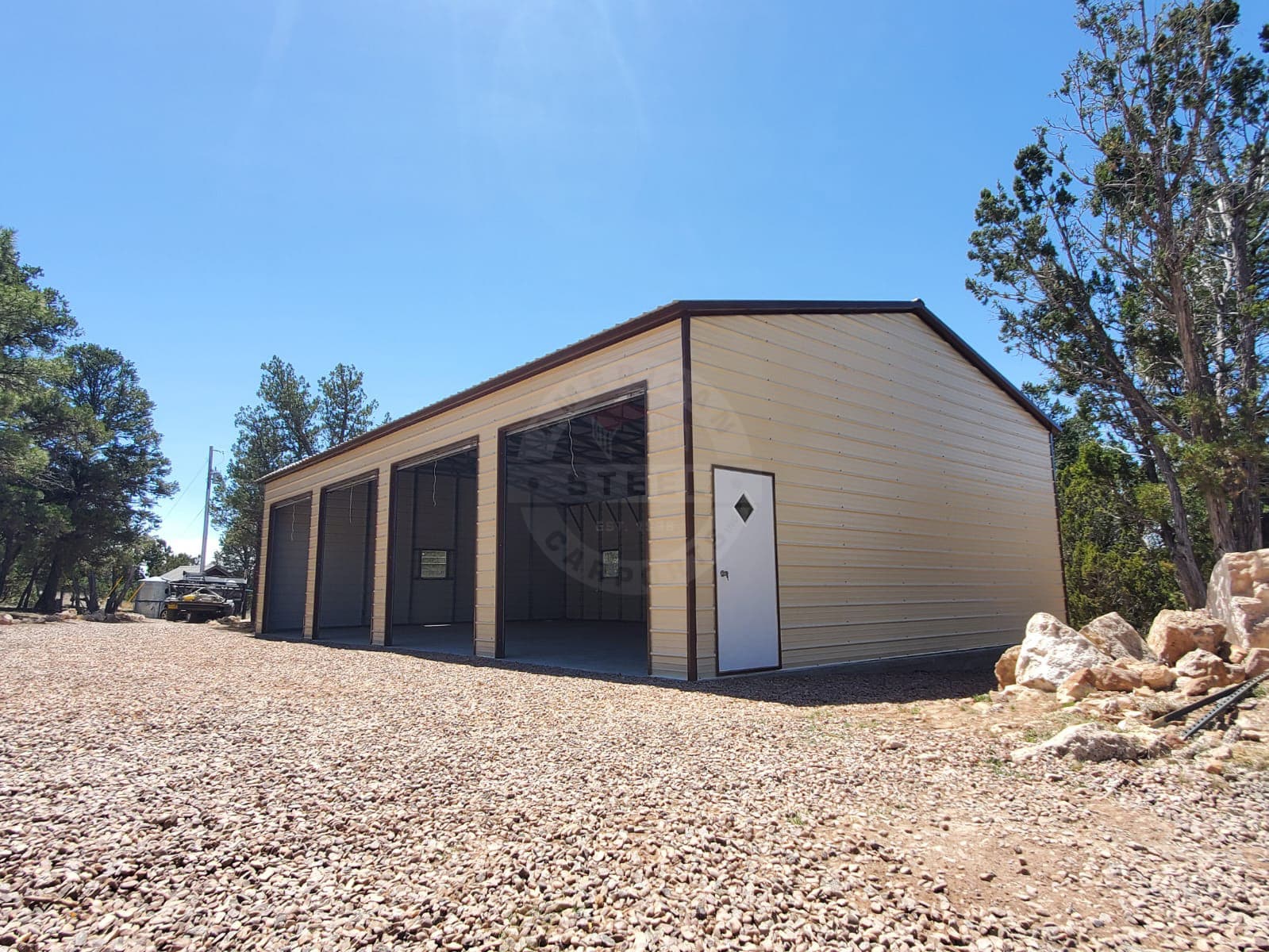 A large steel building with multiple bays, suited to a shop-and-living-quarters layout