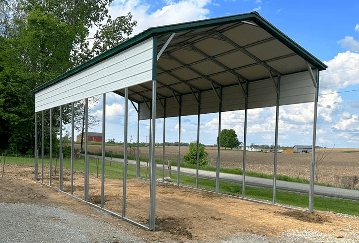 A tall vertical-roof steel cover over a Class A motorhome